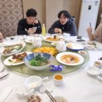 china trip group photo having food